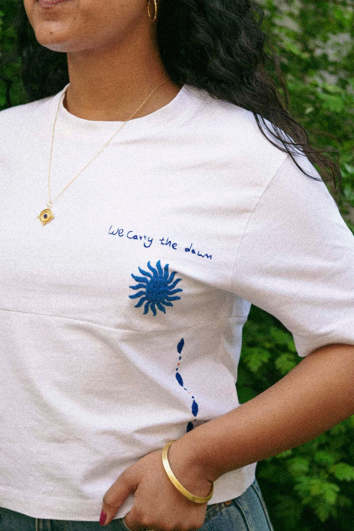 We Carry the Dawn T-Shirt by Artijaan at White Label Project