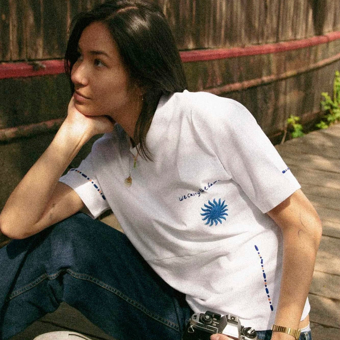 We Carry the Dawn T-Shirt by Artijaan at White Label Project