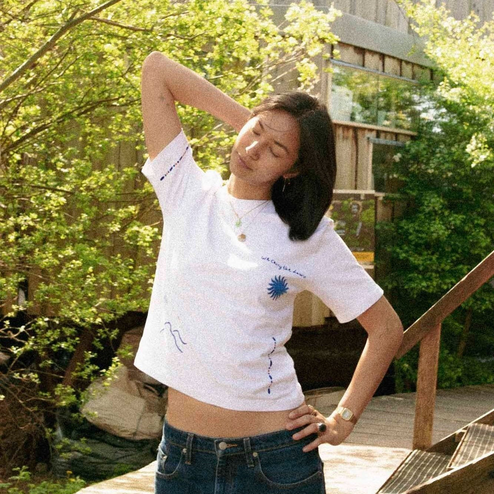 We Carry the Dawn T-Shirt by Artijaan at White Label Project